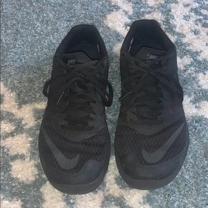 All black Nike running shoes